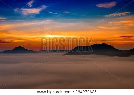 Mountains Under Mist In The Morning With Sunrise At Phutoke Loei Thailand