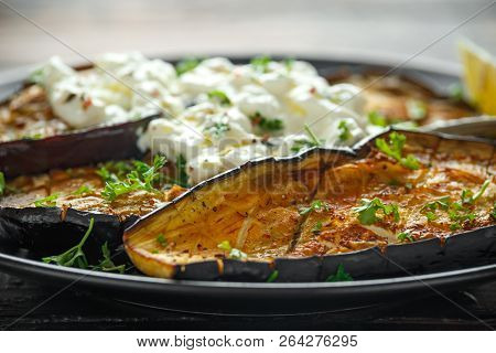 Healthy Vegeterain Oven Baked Aubergines, Eggplant With Cottage Cheese Dip, Parsley And Lemon Wedge.