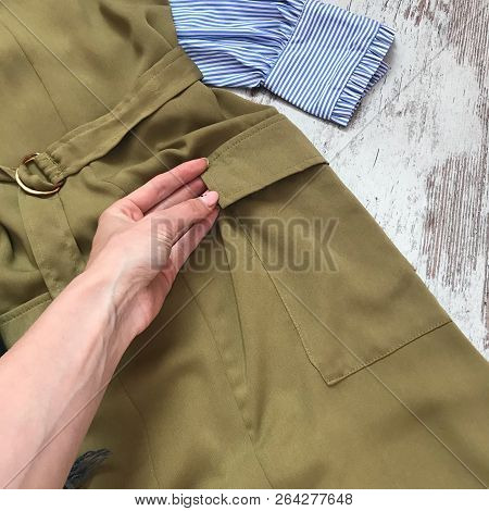 Haki Dress Close Up On Wooden Background