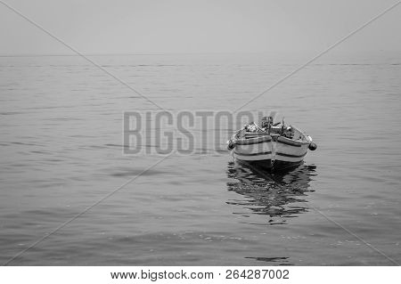 Boat Harbor And Waves And Rocks
