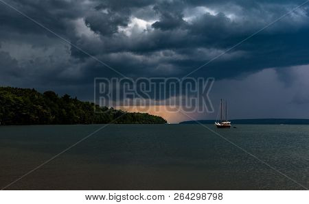 Sail Boat Storm Comingsail Boat On Grey Water Storm Clouds And Rain In Horizen