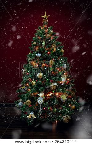 View Of Nice Decorated Christmas Tree On Deep Red Back