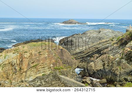 Bay With The Waves Breaking On Its Rocks In The Background A Small Island In Tapia De Casariego. Nat