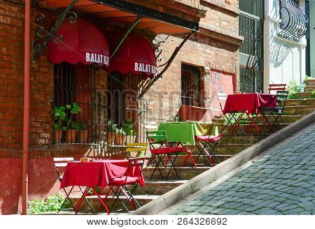 Istanbul, Turkey - September 20, 2018. Multi-colored Tables Of The Summer Cafe On The Stairs Slope I
