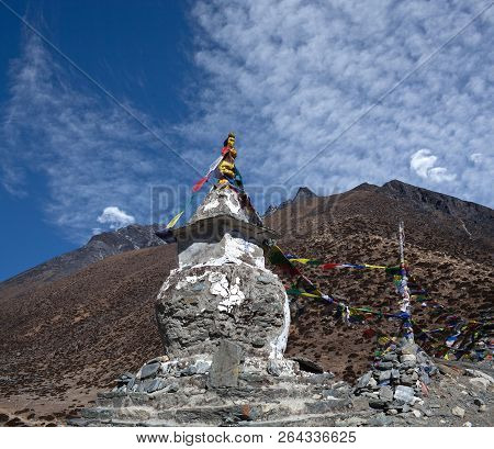 Ancient Buddhist Stupa With Prayer Flags Above Dingboche Village On The Way To Everest Base Camp, Sa