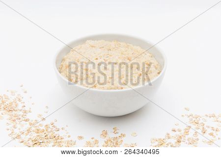 Oatmeal In White Bowl On White Background. Isolated On White. Healthy Food