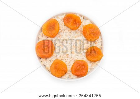 Oatmeal With Dried Apricots In White Bowl On White Bakcground. Isolated On White. Healthy Food