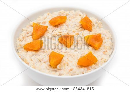 Oatmeal With Dried Apricots In White Bowl On White Bakcground. Isolated On White. Healthy Food