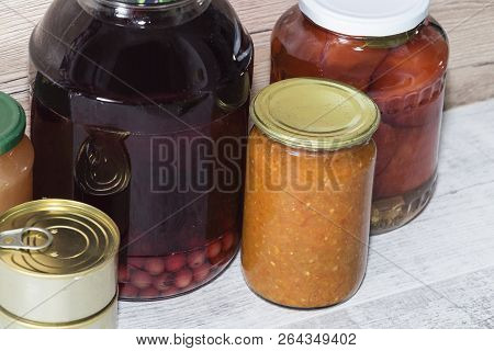 Storage Shelves In Pantry With Homemade Canned Preserved Fruits And Vegetables