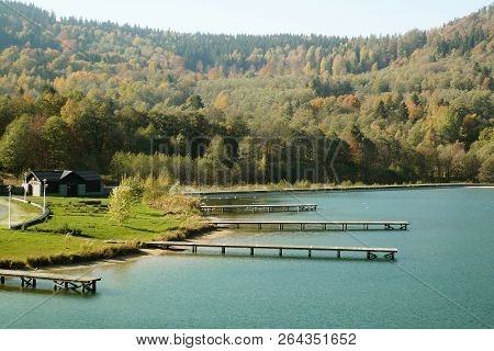 A Simple Wooden Pier On Lake Stara Morawa, A Holiday Resort In Southern Poland