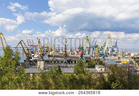 Odesa, Ukraine - July 14,2015: Lifting Cargo Cranes, Ship And Grain Dryer In Sea Port Of Odessa. Ode