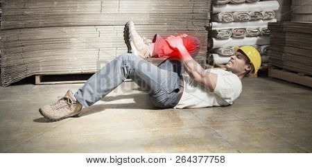 Highlighted pain against worker lying on the floor in warehouse