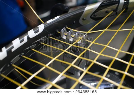 Man Is Restringing A Tennis Racket With Machine