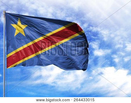 National Flag Of Congo Democratic On A Flagpole In Front Of Blue Sky