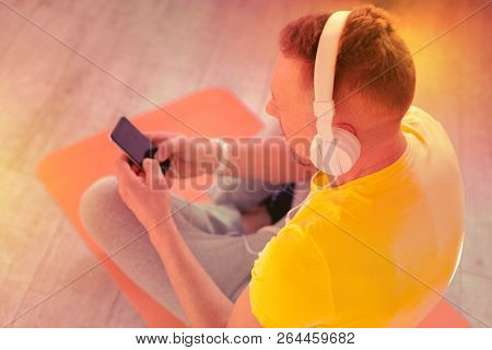 Pleasant Relaxed Man Sitting On The Floor In The Room
