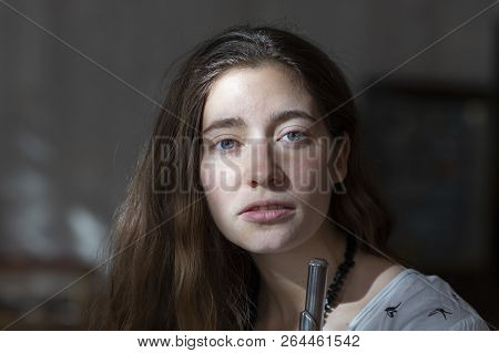 Girl Plays On Flute. Flute In Hands Of Girl During The Concert. Professional Musician Playing On Flu