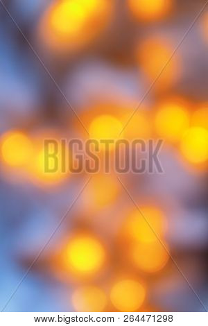 Background From Blurry Light Lights Of Fir-tree Garland On Dark. Copy Space.