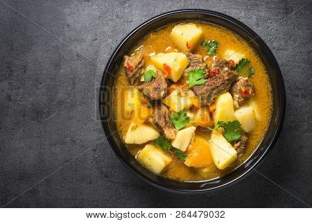 Goulash With Meat And Vegetables On Black Background. Beef Stew With Vegetables. European Cuisine. T