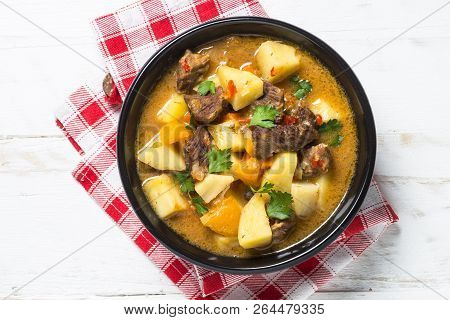 Goulash With Meat And Vegetables On White Wooden Table. Beef Stew With Vegetables. European Cuisine.