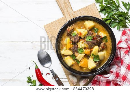 Goulash With Meat And Vegetables On White Wooden Table. Beef Stew With Vegetables. European Cuisine.