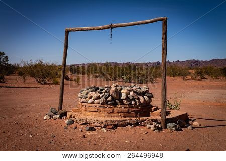 Well Surrounded By Stones Called Aljibe. Excavation On The Floor To Extract Water.