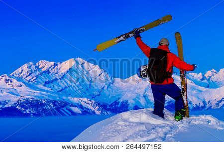 Skitouring with amazing view of swiss famous mountains in beautiful winter powder snow of Alps. 
