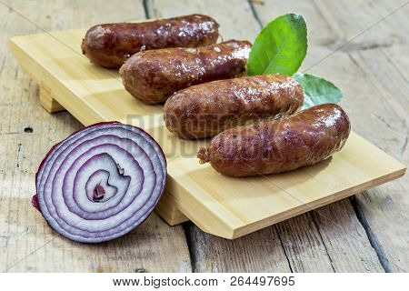 Grilled Sausages On Cutting Board