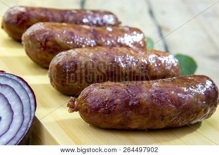 Grilled Sausages On Cutting Board