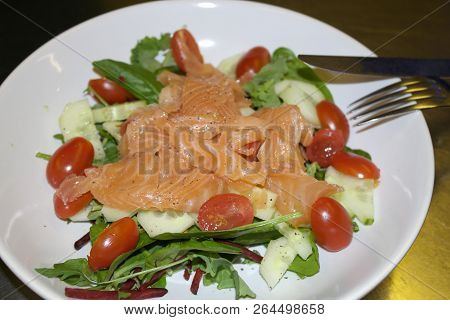 Tasty Smoked Salmon Salad With Tomatoes And Green Letucce