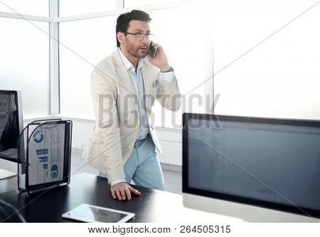 background image of a businessman in a modern office.