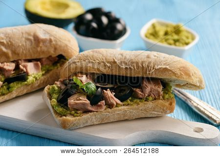 Bruschetta With Tuna, Olives And Avocade Spread.