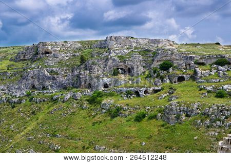 View Of Ravine Canyon With Rocks And Houses In Caves Di Murgia Timone Near Old Ancient Town Matera (