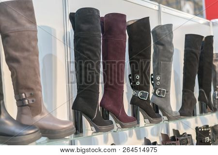 Womens Boots On The Shelves In The Store. Pavilion Of The Store With Fashionable Womens Shoes. Leath