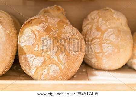 Fresh Round Bread On The Shelf In The Store. Bread On The Shelves. Fresh Round Bread On The Shelf In