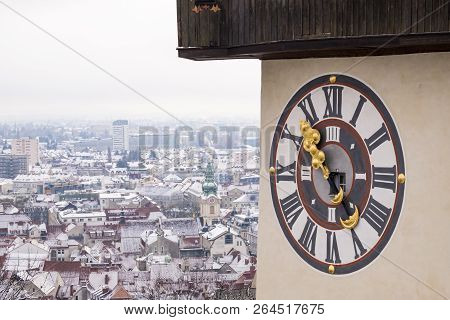 Clock Of Landmark Uhrturm On Schlossberg In Town Graz On A Snowy Winterday