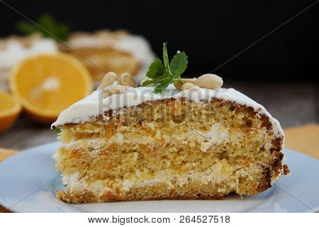 Orange And Carrot Piece Of Cake, Wooden Background. Rustic Style.