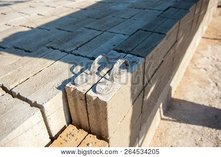 mMan making brick from concrete mix