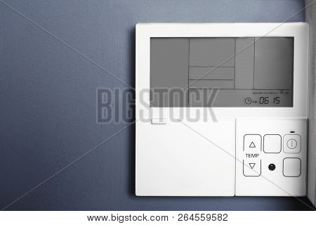 Modern Thermostat On Grey Wall With Space For Text. Heating System