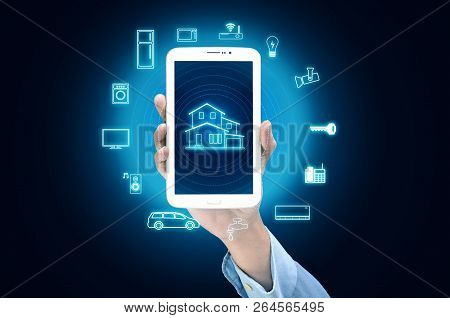 Internet Of Things And Smart Home Concept. Controlling Everything With A Smart Phone Or Gadget Using