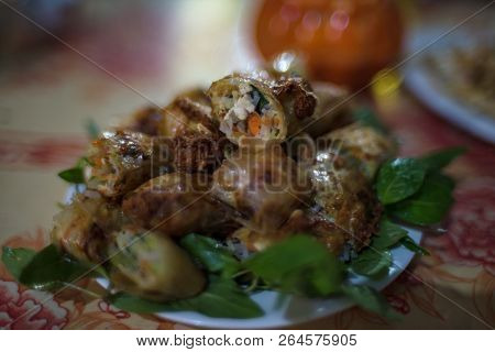 Traditional Vietnamese Springrolls On A Plate. Vietnamese Cuisine Meal Background