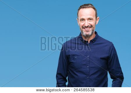Middle age hoary senior man over isolated background with a happy and cool smile on face. Lucky person.