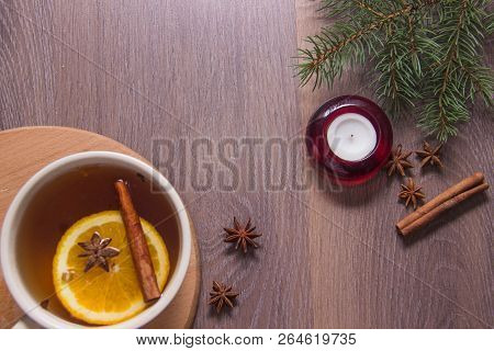 A Cup Of Hot Delicious Tea With A Croissant On A Wooden Platform With A New Years Decor In The Form 
