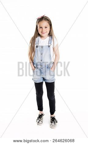 Portrait Of A Cute 7 Years Old Girl Isolated Over White Background
