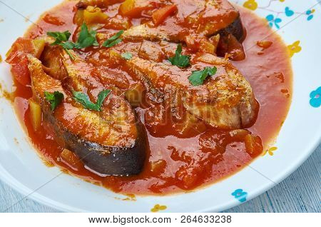 Machcha Besarou, Fried Fish Marinated In Turmeric And Cooked In Mustard, Garlic And Tomatoes Is A Ty