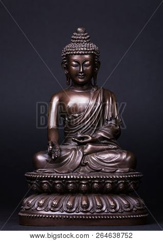 Buddha's Figure, Made Of Metal In A Meditation Pose