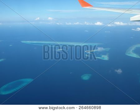 Maledives From Plane In The Water And Island