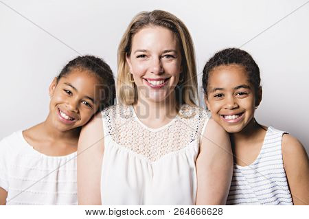 White Skin Caucassian Mother With Black Twin In Studio White