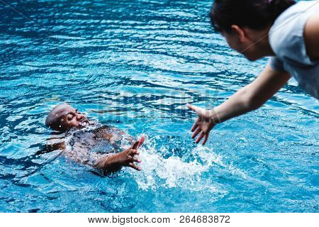 Man being rescued from the water