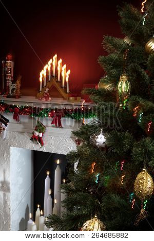 View Of Nice White Christmas Decorated Fireplace  And Christmas Tree