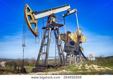 Oil Pump Is On A Background Mountains